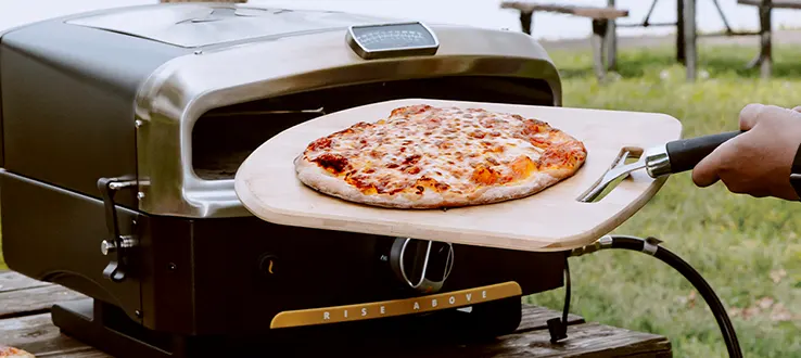 making pizza at home on the Halo Versa 16 Outdoor Pizza Oven2